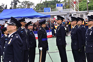 Reviewing officer inspecting graduating officers during the Passing-out Parade